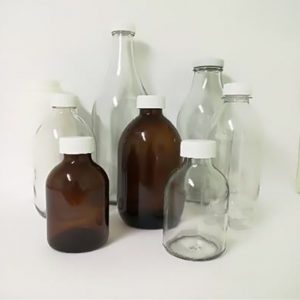 Clear And Brown Glass Bottles In Different Sizes